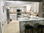 Brand new kitchen with lots of storage and cooking space